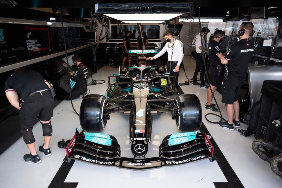 Mercedes' British driver Lewis Hamilton's car is maintained in the pits prior to the third practice session at the Circuit of The Americas in Austin, Texas
