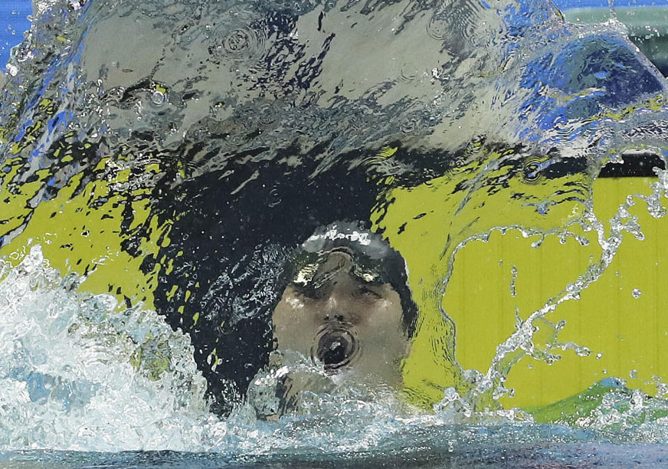 Japan's Daiya Seto celebrates after breaking the world record during the men's 200m butterfly finals at the 14th FINA World Swimming Championships in Hangzhou, China on Tuesday Dec. 11, 2018. Seto set a new world record with a time of 1:48.24. (AP Photo/Ng Han Guan)
