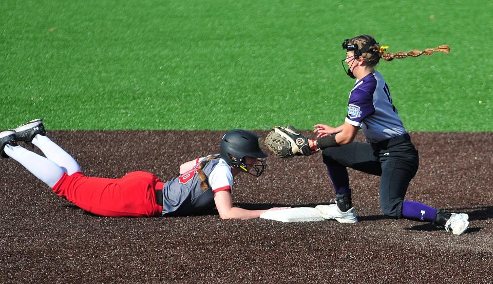 Ferris State University’s Kacey Bouche slides into second base as Ashland University’s Ashley Veldheer makes the catch at second base during a softball game Tuesday, April 11, 2023 at Ashland University’s Deb Miller Field at Archer Ballpark Complex.