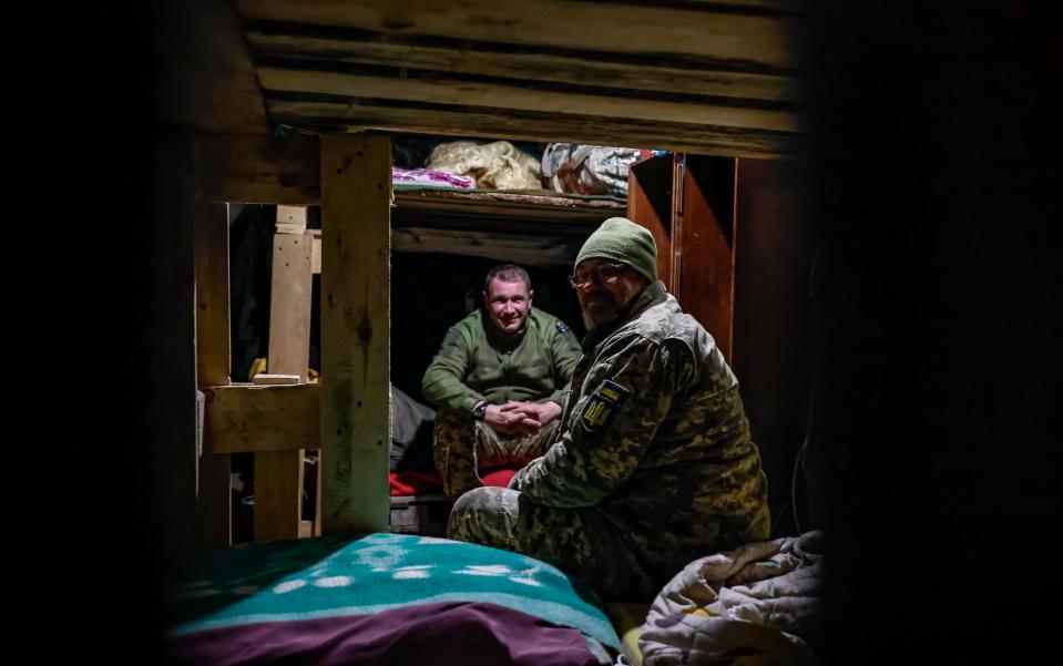 Ukrainian soldiers in a dugout near Kherson (EPA)