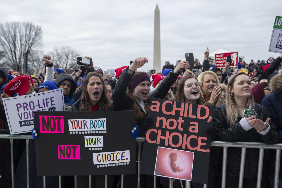 FILE - In this Jan. 24, 2020, file photo, supporters cheer as President Donald Trump speaks during the annual "March for Life" rally on the National Mall, in Washington. Anti-abortion leaders across America were elated a year ago when Donald Trump became the first sitting U.S. president to appear in person at their highest-profile annual event, the March for Life held every January. The mood is more sober now — a mix of disappointment over Trump’s defeat and hope that his legacy of judicial appointments will lead to future court victories limiting abortion rights. (AP Photo/ Evan Vucci, File)