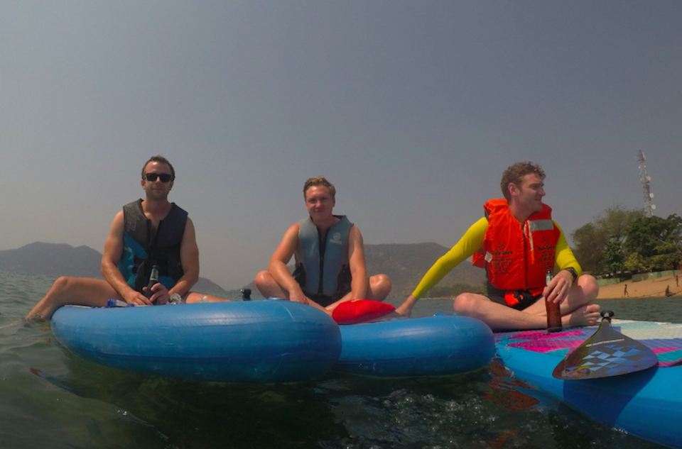  James Michael, centre, with friends at Lake Malawi in 2017 (Picture: SWNS)