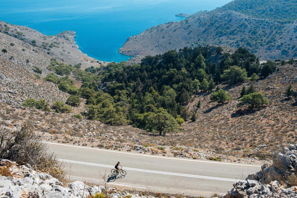 A cyclist on a road near Bodrum Castle, in Turkey