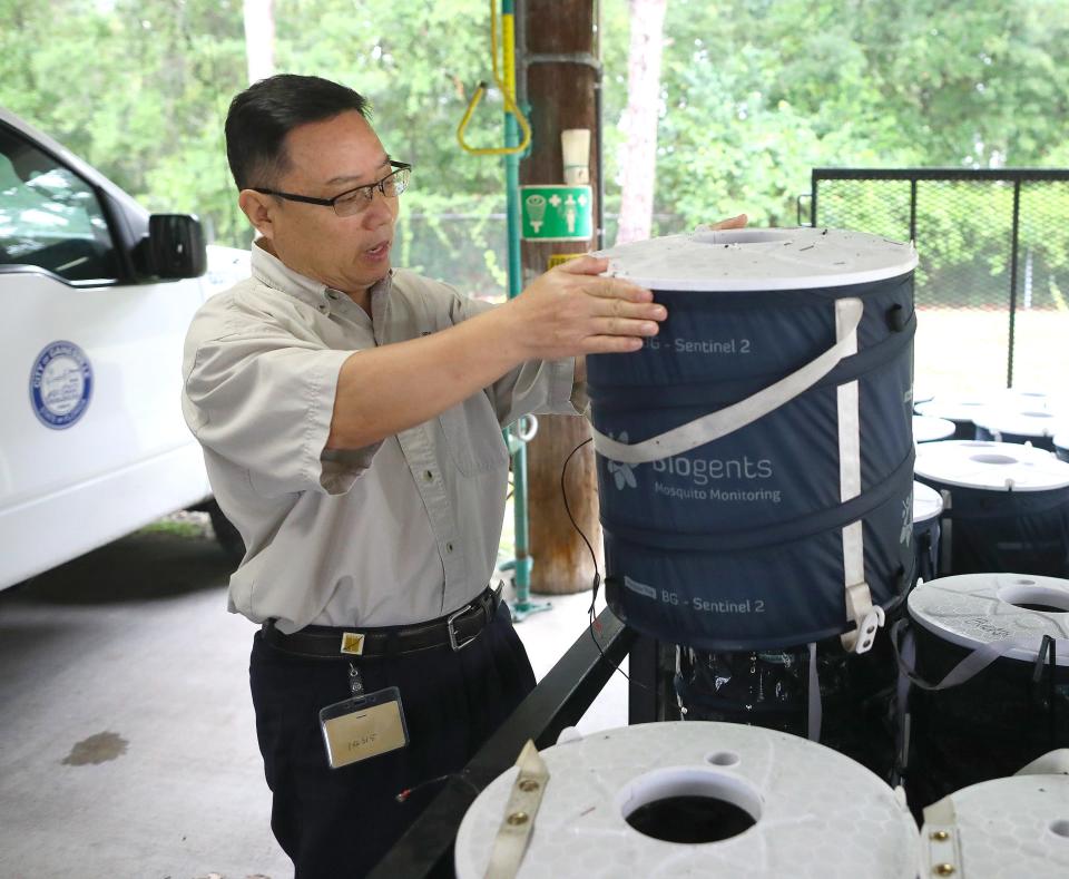 Dr. Peter Jiang, with Gainesville Mosquito Control, holds up a mosquito trap called a BG-Sentinel 2 at the City of Gainesville Public Works Department complex, in Gainesville FL. June 7, 2022. Gainesville has around 43 species of mosquitoes and 10 that bite humans. The Gainesville Mosquito Control is using many methods to control the mosquito population in Gainesville.
