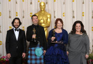 Mark Andrews (second left) and Brenda Chapman with the Oscar for Best Animated Feature for Brave alongside Paul Rudd (far left) and Melissa McCarthy (far right) at the 85th Academy Awards at the Dolby Theatre, Los Angeles.