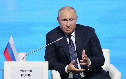 Vladimir Putin speaks at a forum in Vladivostok on Thursday - Credit: Andrey Rudakov/Bloomberg