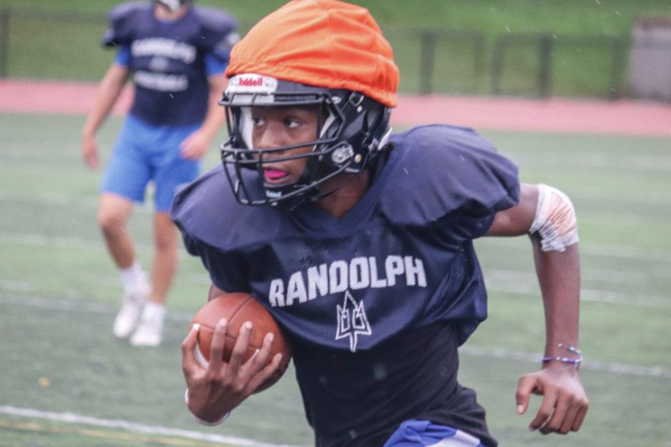 Randolph's Malik White carries the football at Randolph football practice on Sept. 9, 2021.