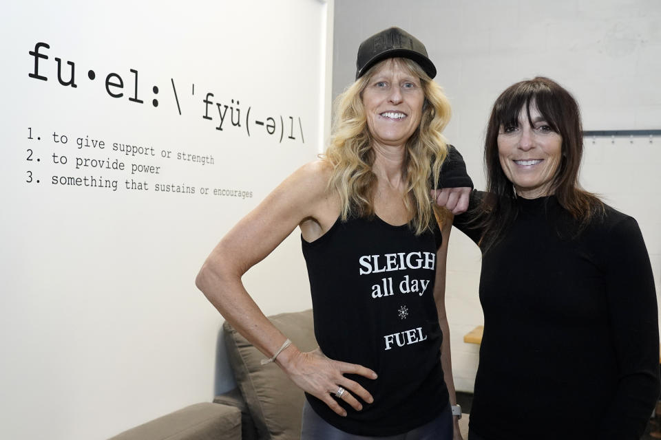 Fuel Training Studio owners Julie Bokat, left, and Jeanne Carter pose for a photo inside their gym, Thursday, Jan. 19, 2023, in Newburyport, Mass. Gyms and fitness studios were among the hardest hit businesses during the pandemic. But for gyms who made it through the worst, signs of stability are afoot. (AP Photo/Mary Schwalm)