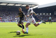 Southampton's Adam Armstrong, left and West Bromwich Albion's Alex Mowatt vie for the ball, during the English Football League Championship play-off, semi-final, first leg soccer match between West Bromwich Albion and Southampton, at The Hawthorns, in West Bromwich, England, Sunday May 12, 2024. (Bradley CollyerPA via AP)
