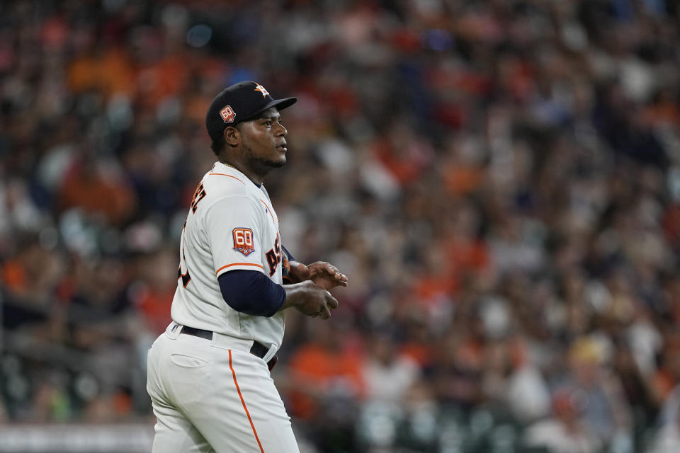 Houston Astros starting pitcher Framber Valdez walks back to the mound after walking Miami Marlins' Bryan De La Cruz with the bases loaded during the second inning of a baseball game Saturday, June 11, 2022, in Houston. (AP Photo/David J. Phillip)