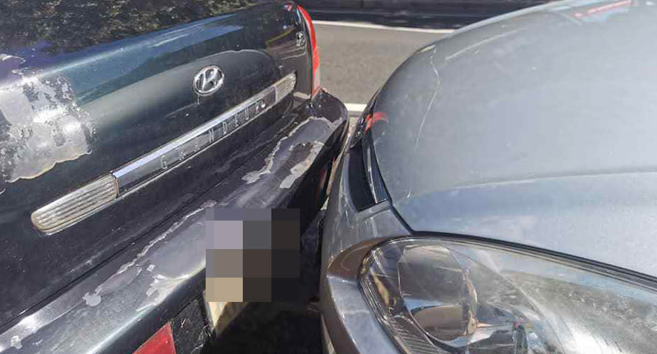 A car parked extremely close to another car in Marrickville.