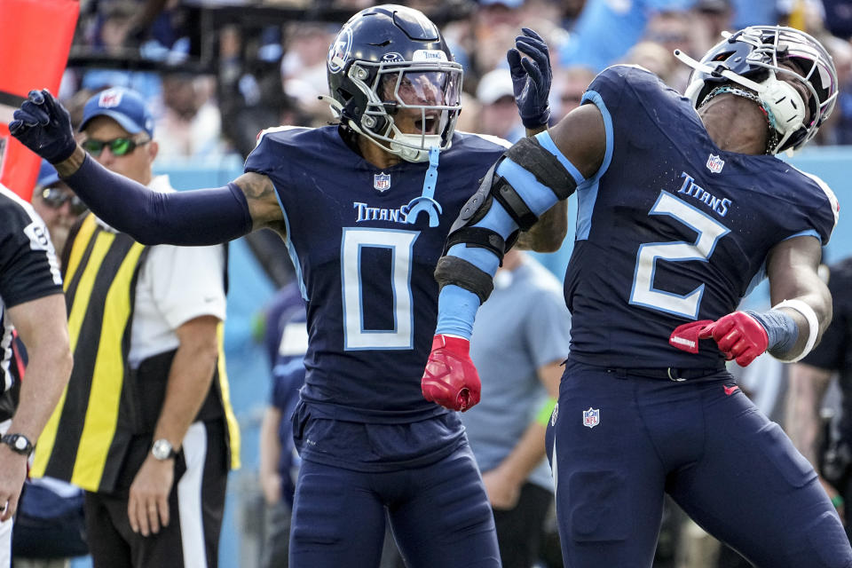 Tennessee Titans' Sean Murphy-Bunting (0) and linebacker Azeez Al-Shaair (2) celebrate a defenste stop against the Cincinnati Bengals during the second half of an NFL football game, Sunday, Oct. 1, 2023, in Nashville, Tenn. (AP Photo/George Walker IV)