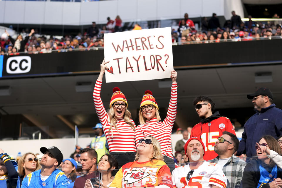Kansas City Chiefs fans hold a sign for singer Taylor Swift during the first half of an NFL football game against the Los Angeles Chargers, Sunday, Jan. 7, 2024, in Inglewood, Calif. (AP Photo/Ashley Landis)