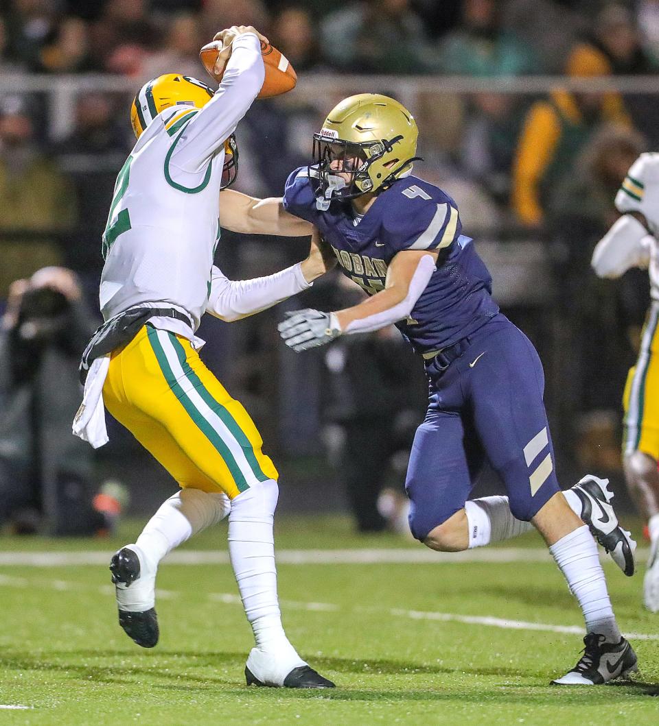 Hoban linebacker Tanner Mintz sacks St. Edward quarterback Thomas Csanyi on Oct. 20 in Akron.