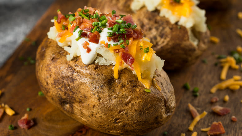 loaded baked potatoes on board
