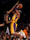 Lakers guard Kobe Bryant, right, shoots over Kings guard John Salmons on March 2 in Los Angeles. (Photo by Stephen Dunn/Getty Images)