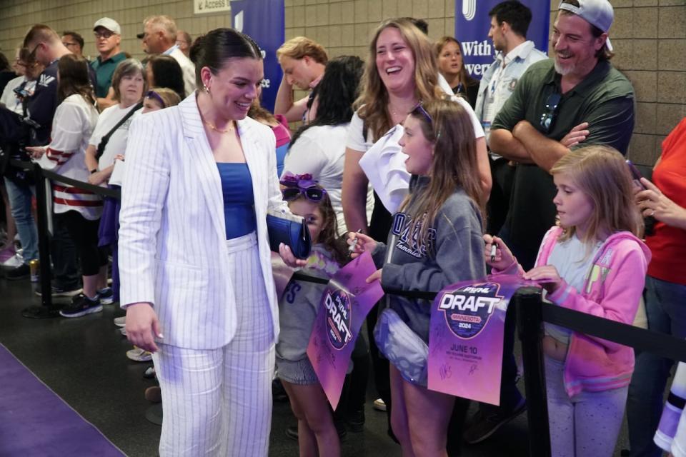 Barnes was all smiles ahead of Monday's draft, walking on the PWHL's purple carpet and signing autographs for fans.