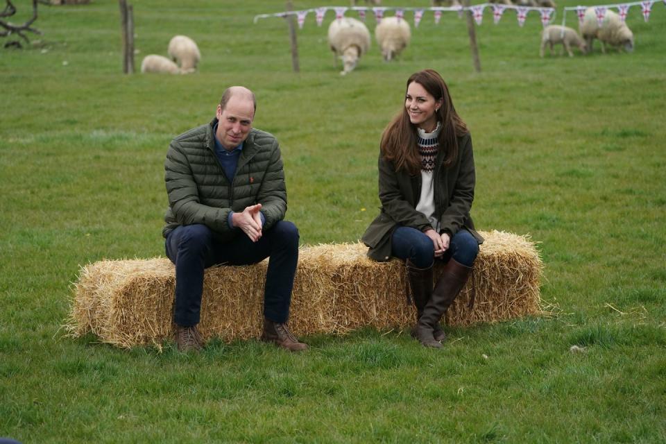 darlington, england april 27 catherine, duchess of cambridge and prince william, duke of cambridge sit on hay balls during a royal visit to manor farm in little stainton, durham on april 27, 2021 in darlington, england photo by owen humphreys wpa poolgetty images