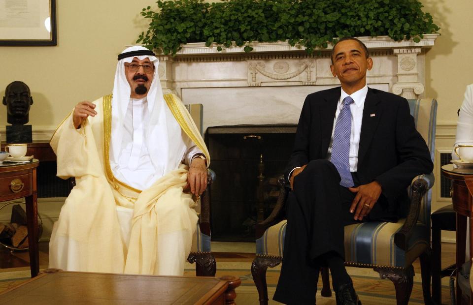 FILE - In this June 29, 2010 file photo, President Barack Obama meets with Saudi Arabia's King Abdullah in the Oval Office of the White House in Washington. President Barack Obama plans a trip to Middle East ally Saudi Arabia next month amid tension in the region. The White House announced Monday that Obama would meet with King Abdullah and discuss security in the region. U.S. policy toward Iran and Syria are certain to be on the list. The stop is being added on to a previously announced trip to Europe at the end of March. It will be Obama's first visit to Saudi Arabia since 2009. (AP Photo/Ron Edmonds, File)