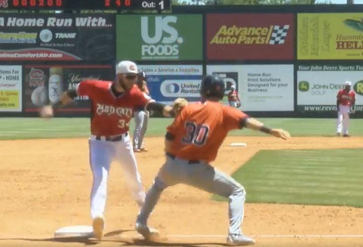 Carolina Mudcats third baseman Lucas Erceg tags out unsuspecting baserunner Kyle Tucker to complete the hidden-ball trick. (Mudcats on Twitter)