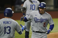 Los Angeles Dodgers' Corey Seager hits a home run against the Tampa Bay Rays during the third inning in Game 4 of the baseball World Series Saturday, Oct. 24, 2020, in Arlington, Texas. (AP Photo/Eric Gay)