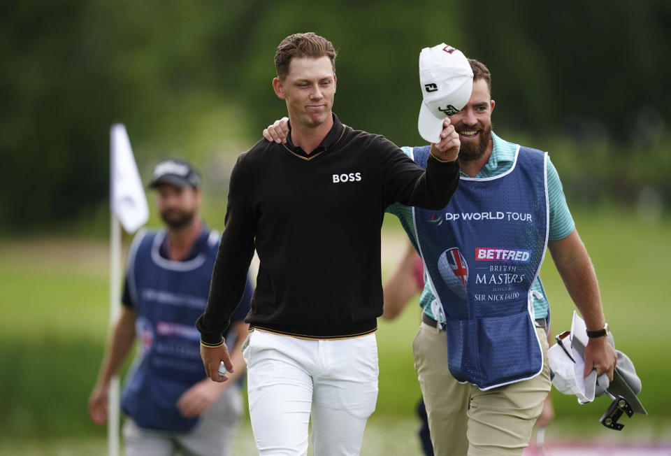Daniel Hillier of New Zealand celebrates after putting on the eighteenth tee, during day four of the Golf British Masters, at The Belfry, in Sutton Coldfield, England, Sunday July 2, 2023. (David Davies/PA via AP)