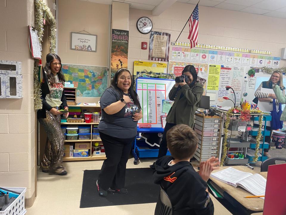 East Cliff Elementary School teacher Christina Hiracheta is surprised in her classroom Monday with a check from the Gregory Portland Education foundation. The grant will fund a take-home telescope program.