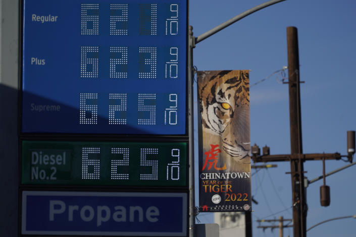 Gasoline prices are displayed at a Chevron gas station downtown Los Angeles, Friday, Feb. 18, 2022. (AP Photo/Damian Dovarganes)