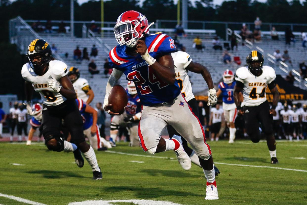 Former Jefferson football player Malaki Starks (24) scores a touchdown during the Dragons 61-7 win over Central Gwinnett during his senior season.