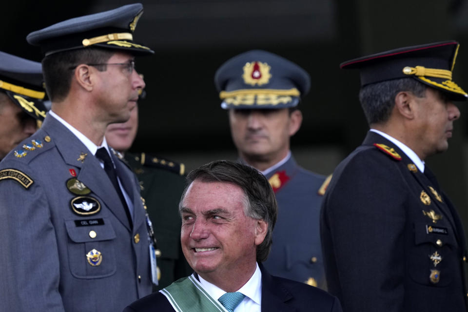 FILE - Brazil's President Jair Bolsonaro attends a ceremony marking Army Day at Army headquarters in Brasilia, Brazil, April 19, 2022. A sign of accommodation from the Brazilian army with President Luiz Inacio Lula da Silva is the recent cancelation of commemorations planned for the April anniversary of the 1964 military coup, a dictatorship-era tradition reestablished during Bolsonaro’s government. (AP Photo/Eraldo Peres, File)