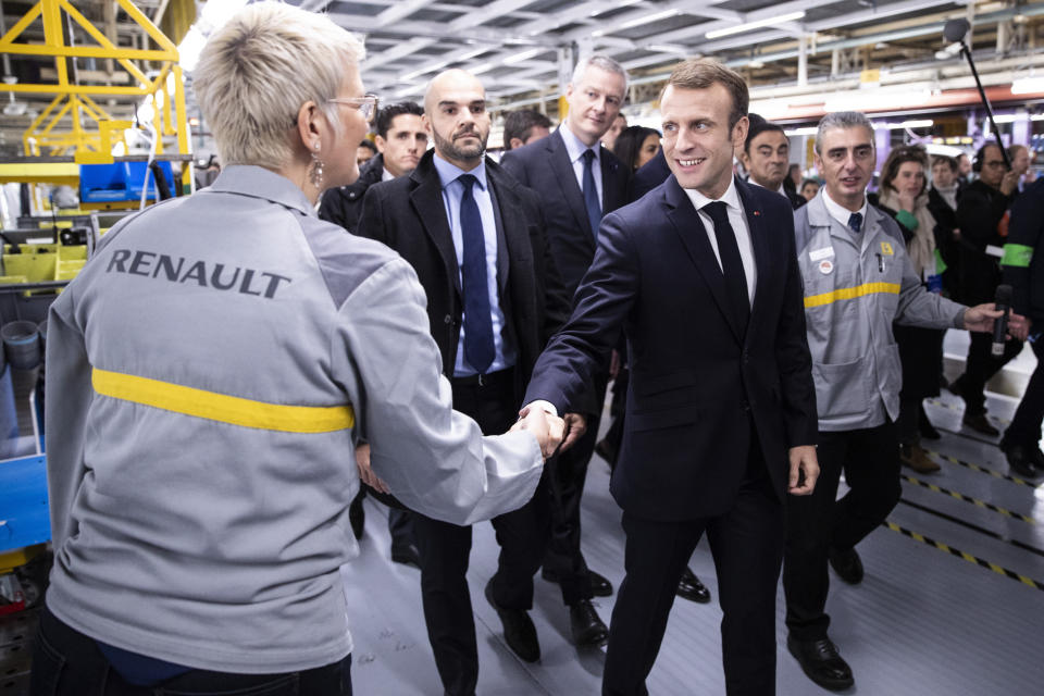 French President Emmanuel Macron shakes hands to workers as he visits the Renault factory in Maubeuge northern France, Thursday Nov. 8 2018. Macron is currently on a six-day tour to visit the most iconic landmarks of the First World War ahead of the celebrations of the 100th anniversary of the 11 November 1918 armistice. (Etienne Laurent, Pool via AP)