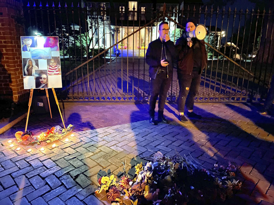 Kori Hennessey, education and programs director at the LGBT Center of Raleigh, leads a vigil for the Transgender Day of Remembrance outside the Governor’s Mansion in Raleigh, N.C., Sunday, Nov. 20, 2022. (AP Photo/Hannah Schoenbaum)