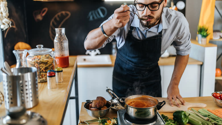 Chef tasting soup