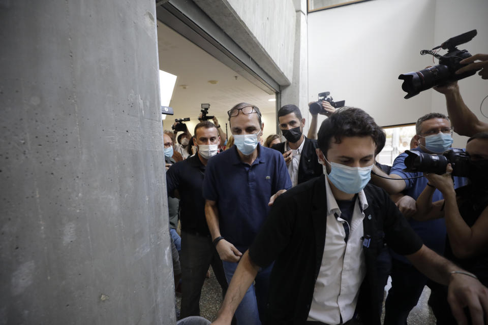 Shmulik Peleg, maternal grandfather of Eitan Biran, who survived a cable car crash in Italy that killed his immediate family, leaves court in Tel Aviv on Thursday, Sept. 23, 2021 for a hearing on charges of kidnapping his grandson. The boy's parents and younger sibling were among 14 killed in May when a cable car slammed into a mountainside in northern Italy. He is now the focus of a custody battle between his maternal grandparents in Israel and his paternal relatives in Italy. (AP Photo/Sebastian Scheiner)