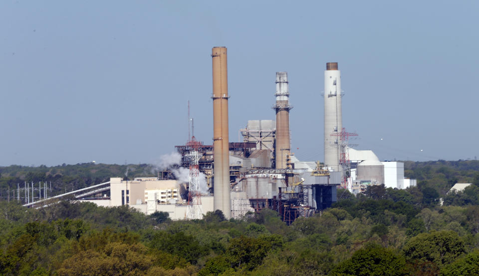 FILE - Dominion Power's coal-fired power plant at Dutch Gap along the James River is shown on Wednesday, April 29, 2015, in Chester, Va. The Biden administration on Wednesday, March 8, 2023, proposed strengthening a rule aimed at reducing polluted wastewater from coal-burning power plants that has contaminated streams, lakes and underground aquifers across the nation. (AP Photo/Steve Helber, File)