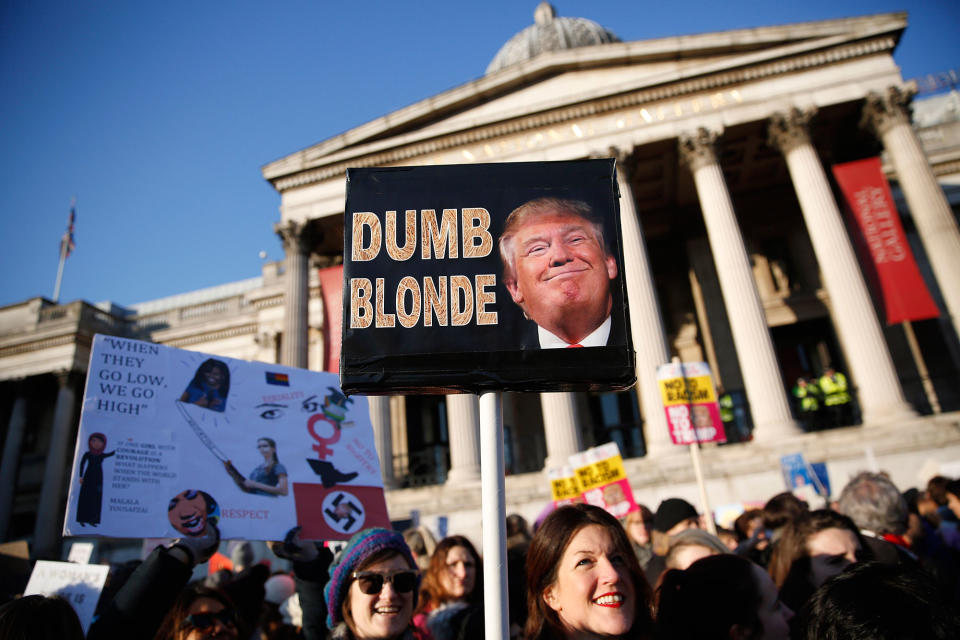 <p>Protesters carrying banners take part in the Women’s March on London, as they stand in Trafalgar Square, in central London, Britain January 21, 2017. The march formed part of a worldwide day of action following the election of Donald Trump to U.S. President. (Neil Halll/Reuters) </p>