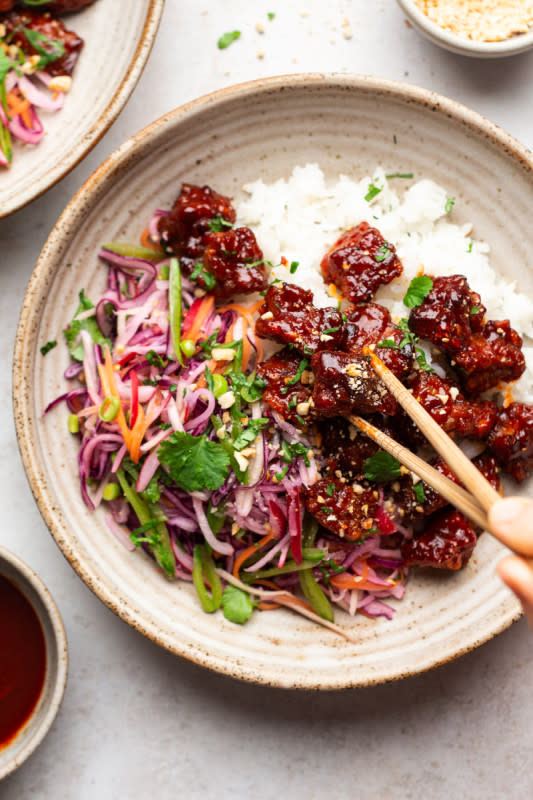 <p>Lazy Cat Kitchen</p><p>Gochujang tempeh is a delicious way to have tempeh, either baked or fried. Paired with rice and a simple slaw it makes for a completely plant-based protein-rich meal. Naturally vegan and gluten-free.</p><p><strong>Get the recipe: <a href="https://www.lazycatkitchen.com/gochujang-tempeh/" rel="nofollow noopener" target="_blank" data-ylk="slk:Gochujang Tempeh;elm:context_link;itc:0;sec:content-canvas" class="link ">Gochujang Tempeh</a></strong></p>