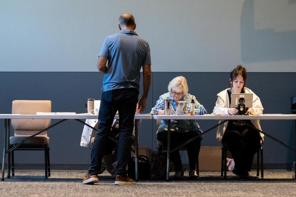 Dave Popowich, of Buckingham, checks in to vote at Covenant Presbyterian Church in Buckingham during the primary election on Tuesday, May 16, 2023.