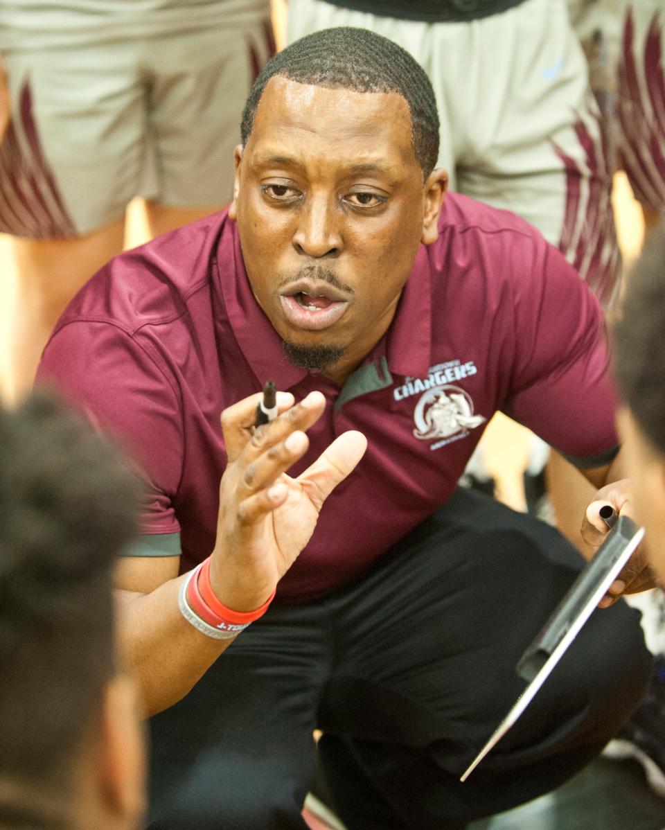 Jeffersontown head basketball coach Richard Duncan, Jr. talks to his players during a time-out in the KHSAA 6th Region Basketball Tournament quarterfinal game.March 03,  2020