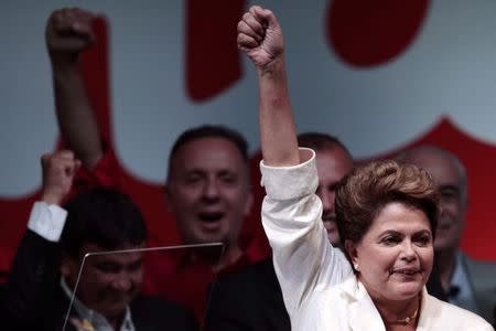 Brazil's President and Workers' Party (PT) presidential candidate Dilma Rousseff celebrates during news conference after disclosure of the election results, in Brasilia October 26, 2014. REUTERS/Ueslei Marcelino