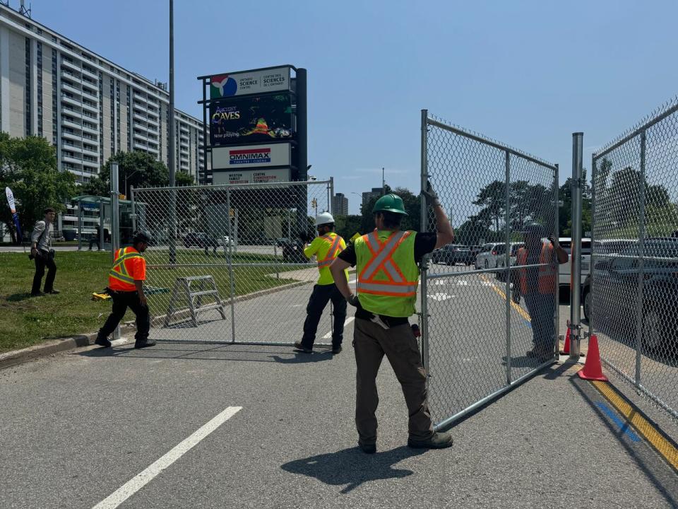 Workers began erecting fencing around the Ontario Science Centre on Friday, as the province announced the building will be immediately closing because of the risk of a roof collapse. The Ontario Science Centre opened in 1969 and the Ford government plans to relocate it to Ontario Place. 