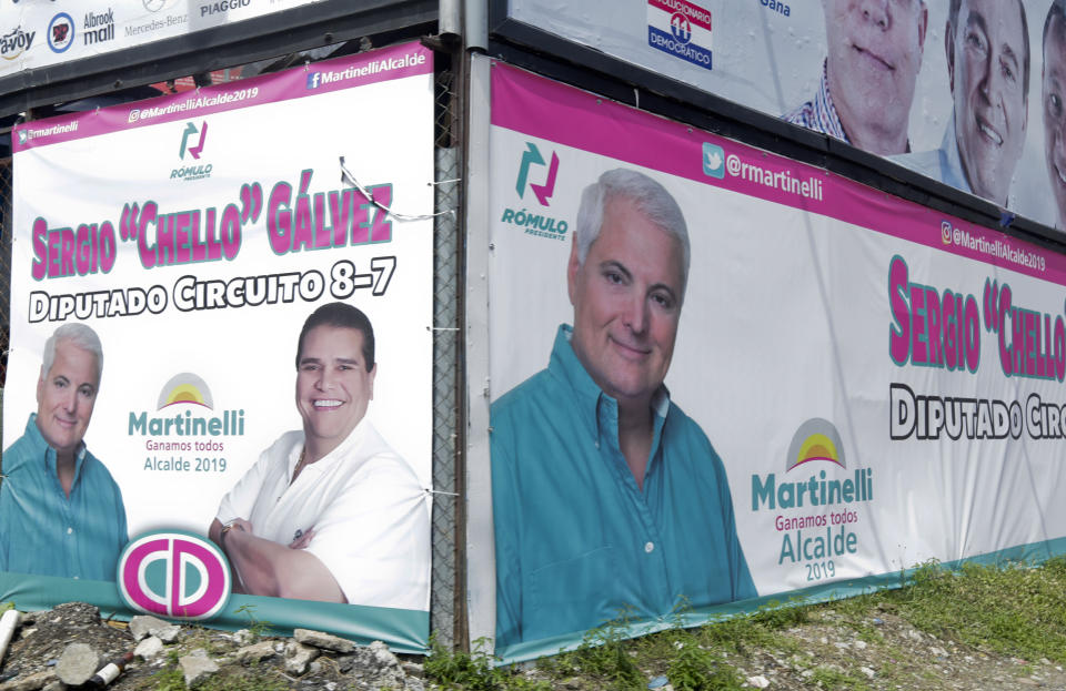 In this April 28, 2019 photo, a billboard promotes former President Ricardo Martinelli as a mayoral candidate for Panama City representing the Democratic Change party, in Panama City. Panama's electoral court ruled that the jailed ex-president may not participate in the May 5th general elections. Martinelli has been behind bars on charges of political espionage since being extradited from the U.S. last June. (AP Photo/Arnulfo Franco)