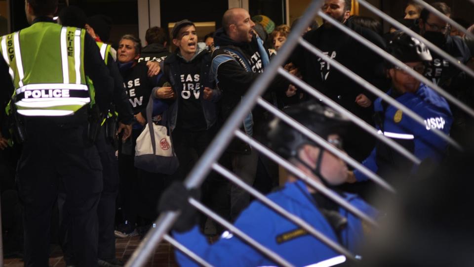 PHOTO: Protesters block the entrance of the headquarters of the Democratic National Committee during a demonstration on Nov. 15, 2023 on Capitol Hill in Washington, D.C. (Alex Wong/Getty Images)