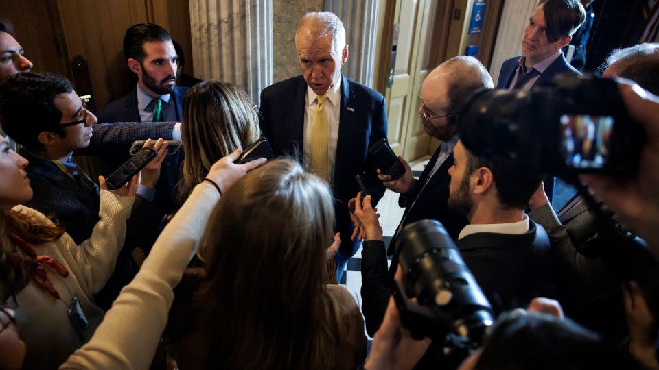 Sen. Thom Tillis talks to reporters as he heads to the Senate floor for a vote on January 23 in Washington, DC. - Samuel Corum/Getty Images