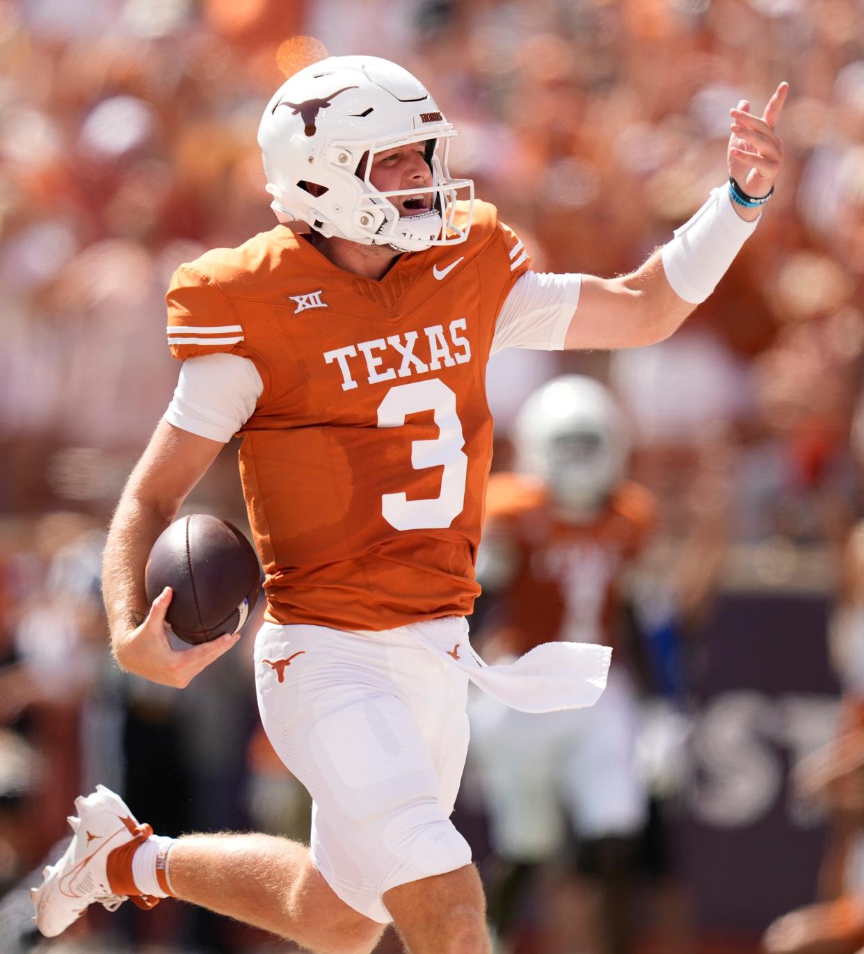 Texas Longhorns quarterback Quinn Ewers runs for a touchdown in the first quarter against the Kansas Jayhawks at Royal-Memorial Stadium on Saturday September 30, 2023.