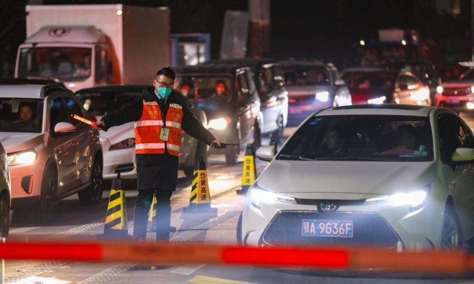 A government worker directs traffic