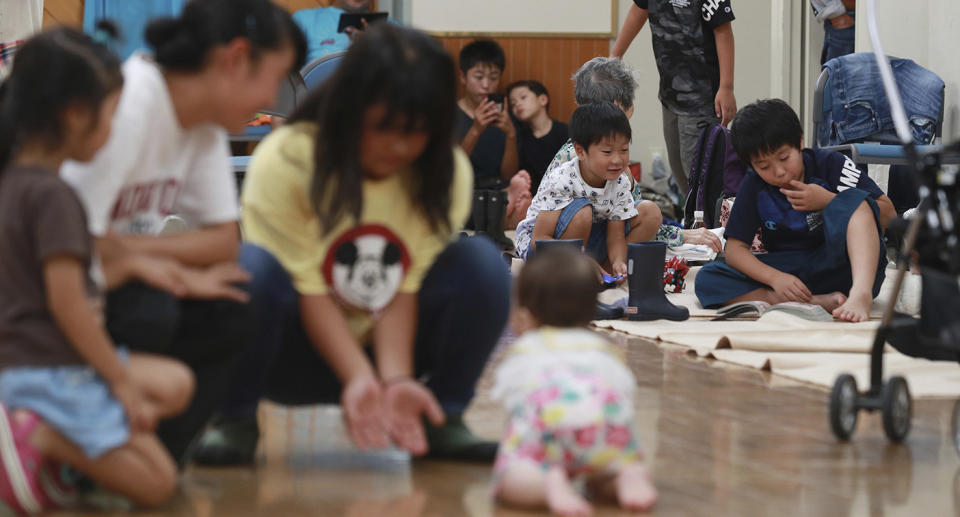 Local people evacuate at a high school GYM in Mishima City, Japan