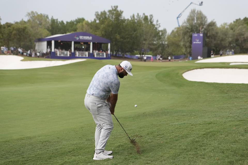 Jon Rahm from Spain plays his second shot on the 15th hole during the round one of the DP World Tour Championship golf tournament, in Dubai, United Arab Emirates, Thursday, Nov. 16, 2023. (AP Photo/Kamran Jebreili)