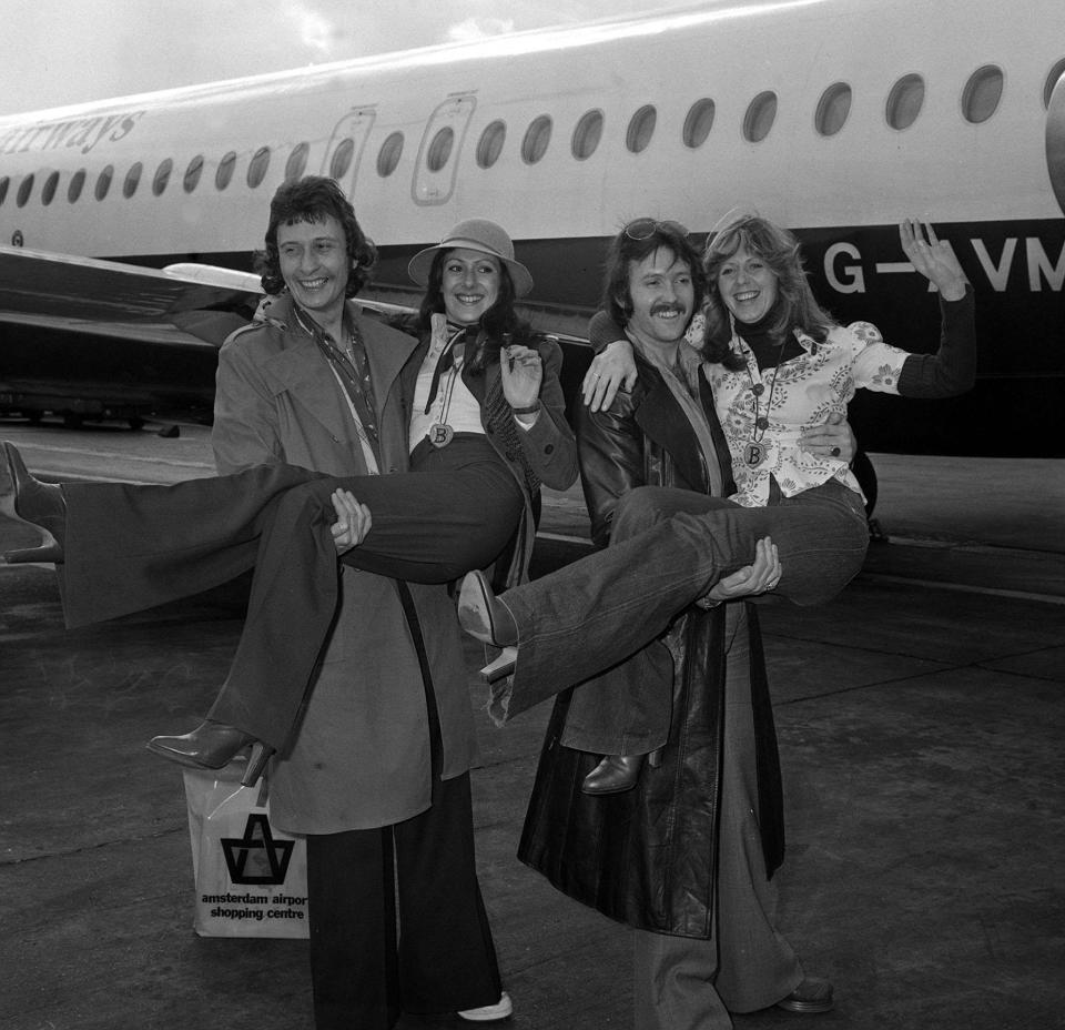 British Pop group Brotherhood of Man returning in triumph to Londons Heathrow Airport, having just won the 1976 Eurovision Song Contest. From l-r: Lee Sheridan, Martin lee, Nicky Stevens, Sandra Stevens   (Photo by PA Images via Getty Images)