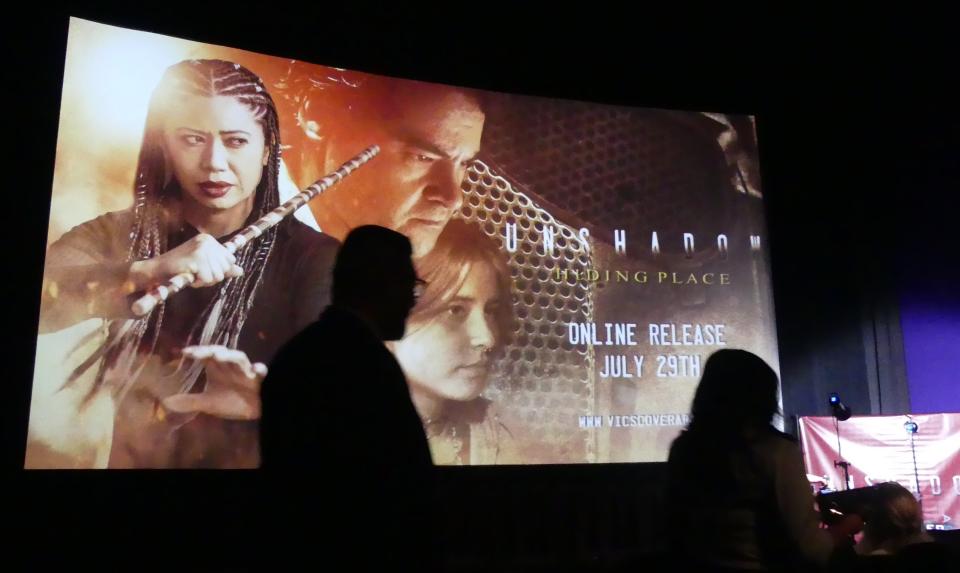 Movie goers arrive for the red-carpet screening of the sci-fi film UNSHADOW: Hiding Place on Sunday at the AMC theater in Apple Valley.